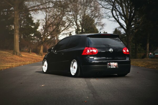 Black Volkswagen Golf, autumn landscape