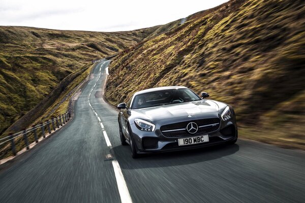 Powerful mercedes amg rides through the mountains