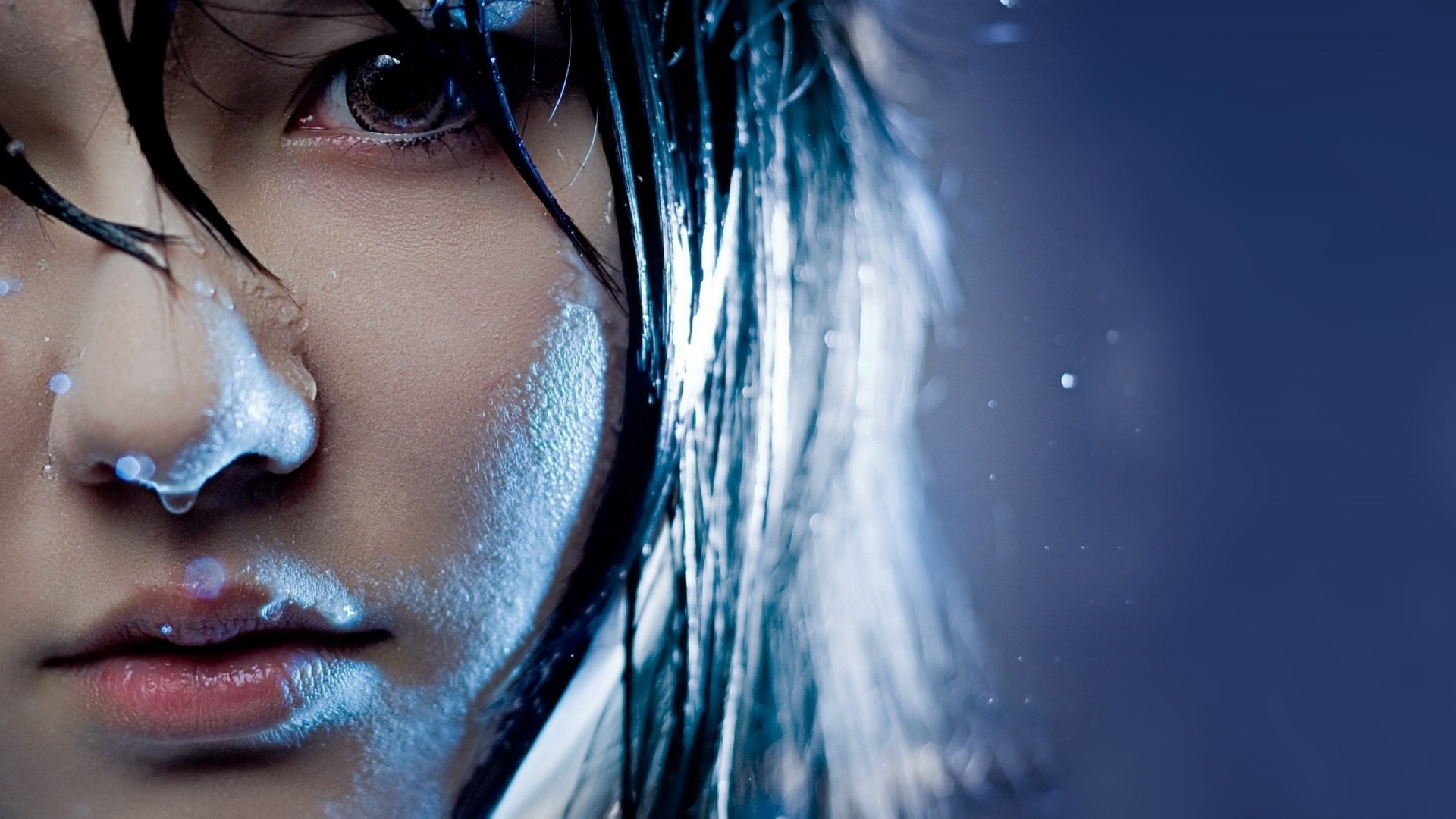 a woman girl asian blue water close up face