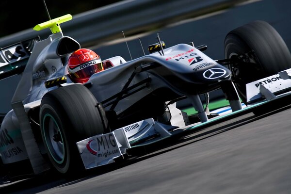 Mercedes racing with a driver on the race track