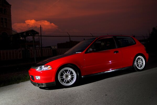 Red car with black hood