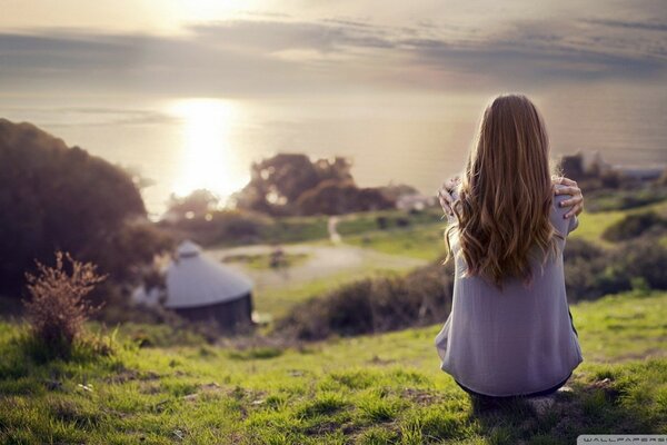 The girl from the back at sunset