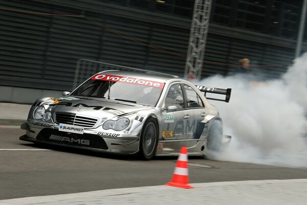 A beautiful smoking sports car on the road