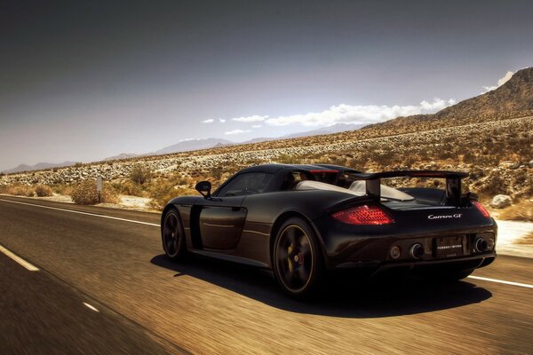 Porsche rides on deserted desert roads