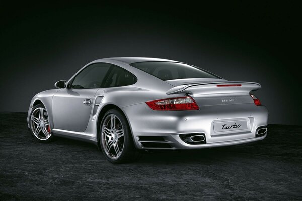 Silver porsche turbo on black background