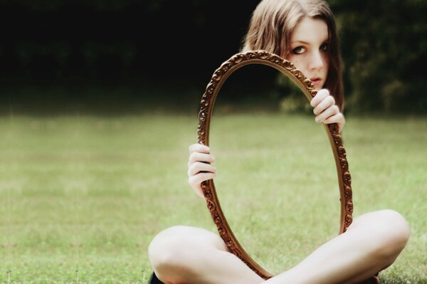 Interesting photo of a girl with a mirror