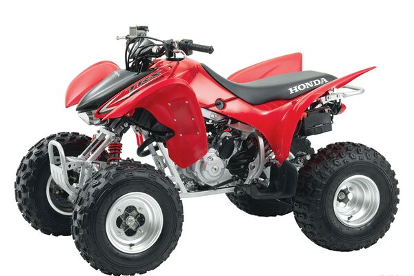 Red Honda tr300 atv. Side view