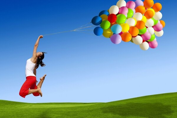Girl with bright balloons