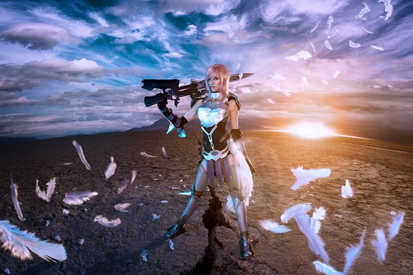 Chica guerrera con armas en medio del desierto