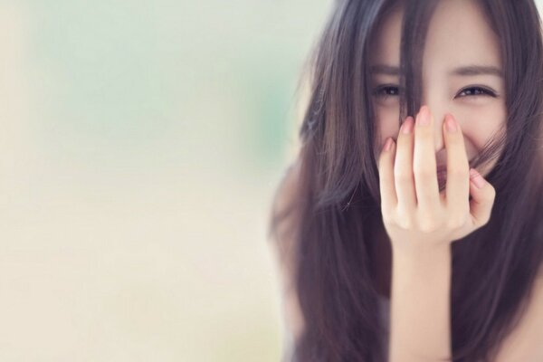 Brunette girl on a gray background