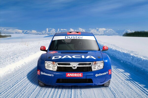 Photographer shoots a car on a snow-covered rally