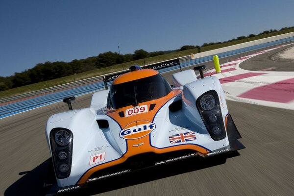 Arrival of a racing car in the early morning