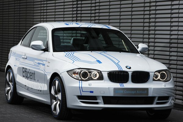White BMW with blue stripes pattern 