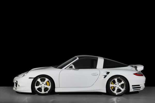 Turbo high-speed white car on a gray background