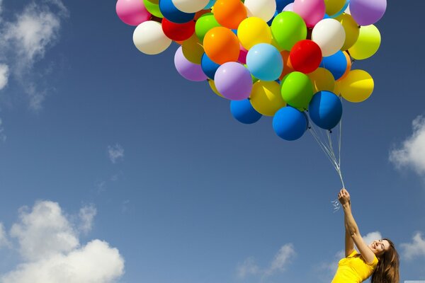 Girl with colorful balloons