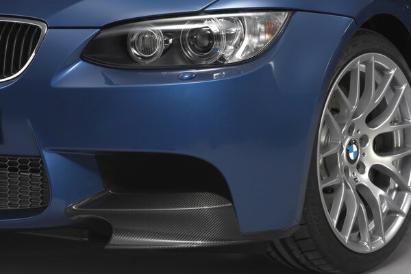 BMW car in blue front headlight view