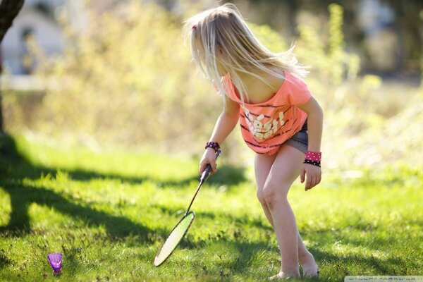 A girl is playing badminton