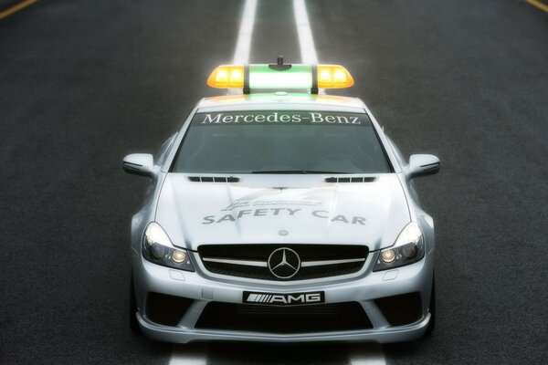 A police Mercedes-Benz is driving on the road