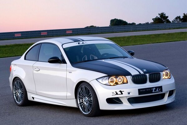 White tuned BMW at the stadium