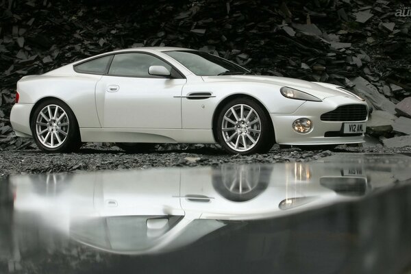 Chrysler in the reflection on a rock in the water