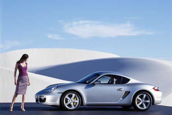 The girl with the silver porsche car