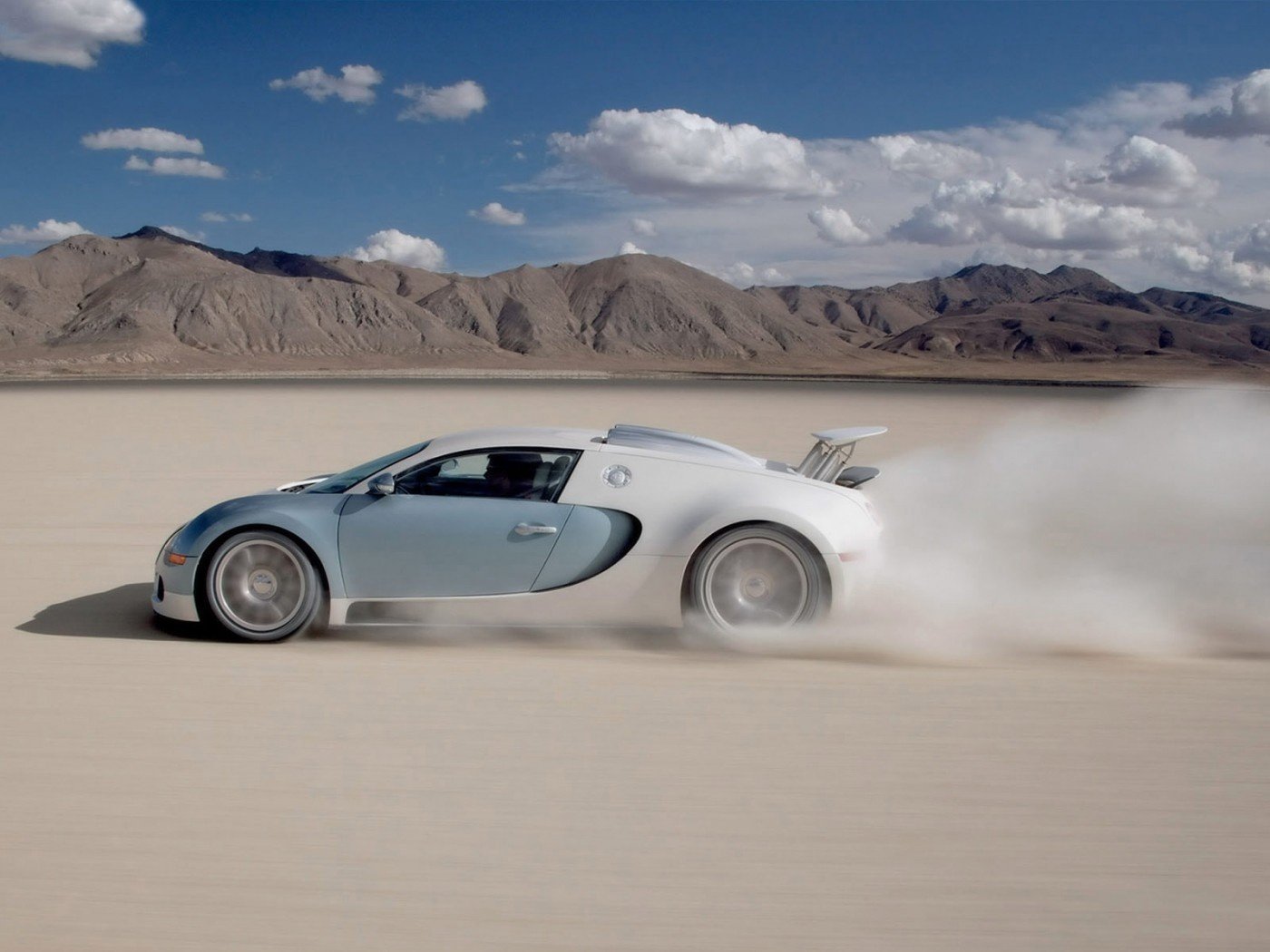 bugatti veyron bugatti veyron desert speed auto white car car wheelbarrow transport dust sand movement nature mountains clouds disks car shape profile style design motor transport