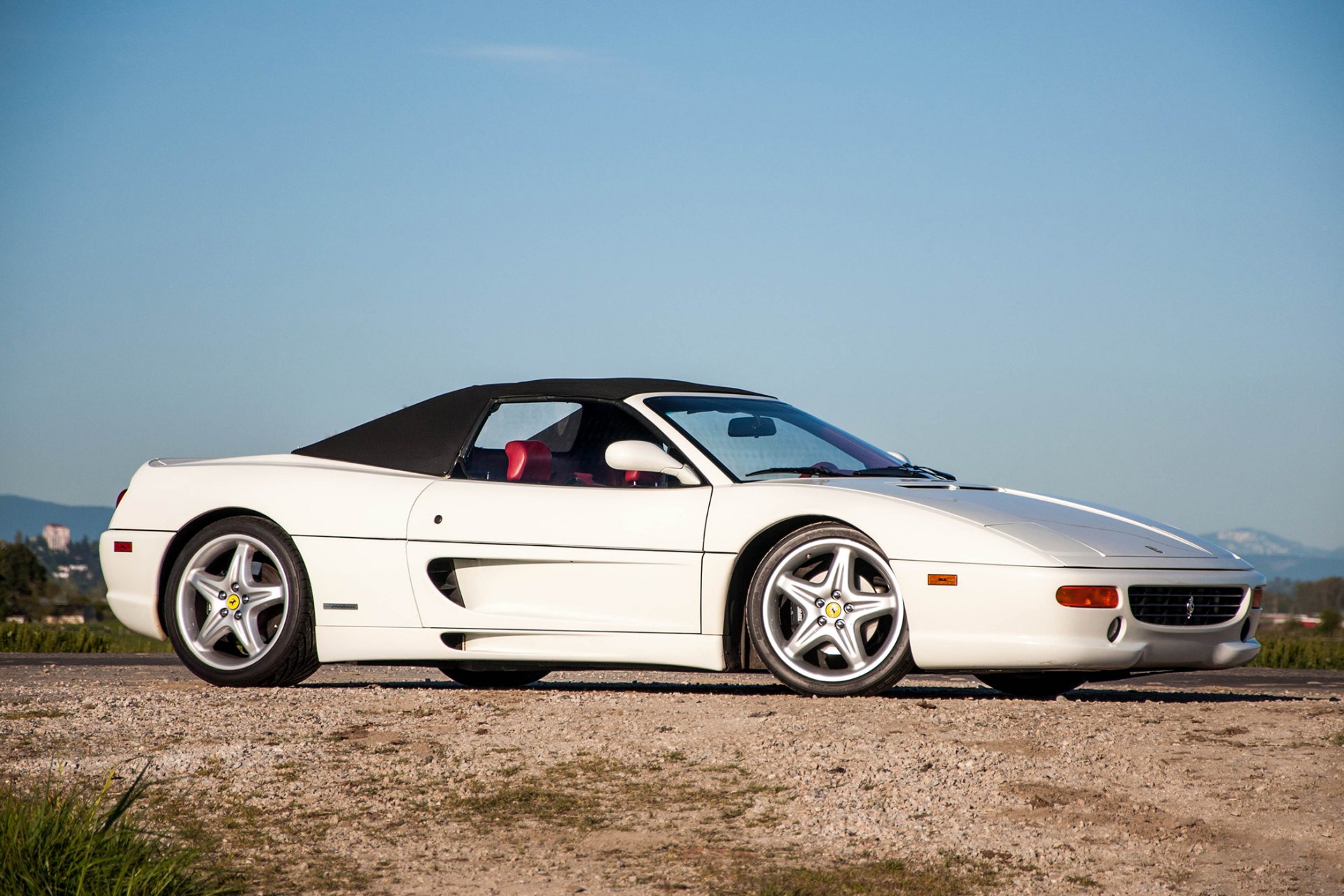 ferrari spider white sky road