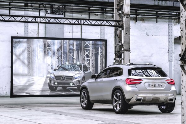 Silver Mercedes in front of the mirror in the hangar