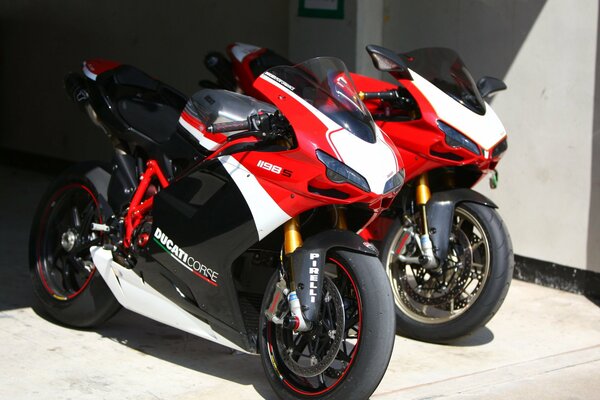 Two sporty red motorcycles