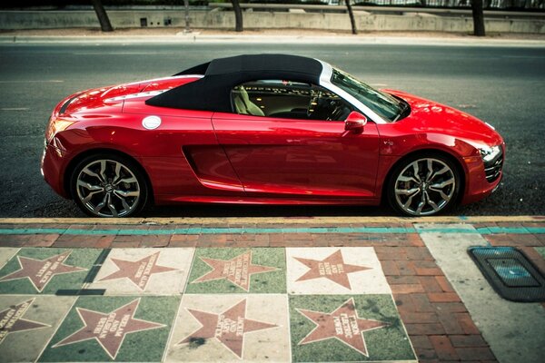 Red Audi R8 parked at the Alley of stars