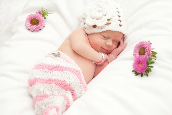 Photo of a cute newborn baby with flowers