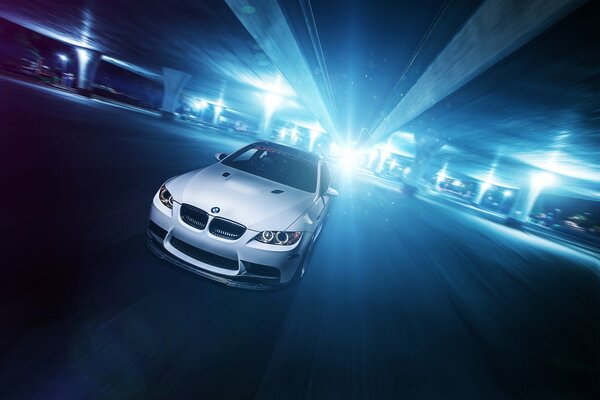 White bmw m3 in front of light glare