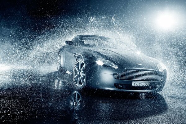 Aston Martin in the lighting in the rain