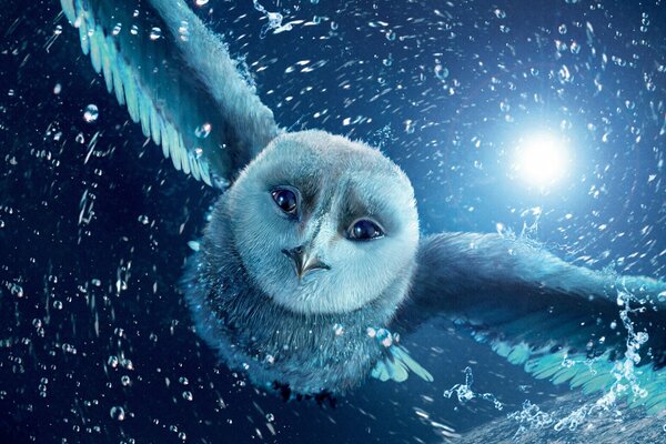 Blue owl with sad eyes in flight