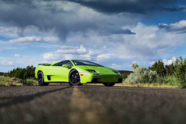 Photo work of a light green lamborghini in nature