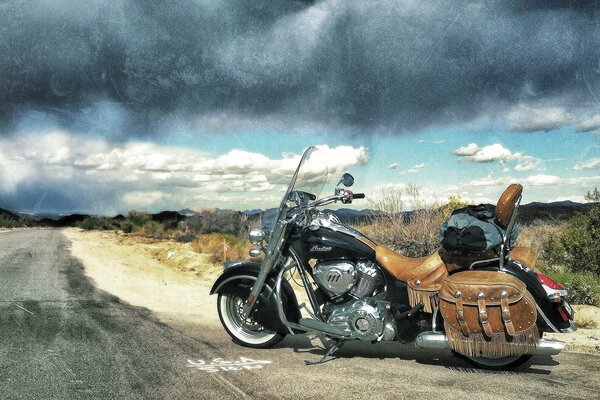 Clouds and clouds at the same time. Motorcycle on the road