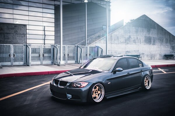 BMW 3 car on the background of buildings