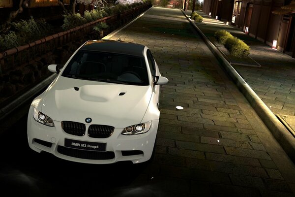 White bmw sports coupe on the background of the city