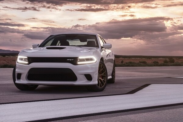 White car on a beautiful sky background