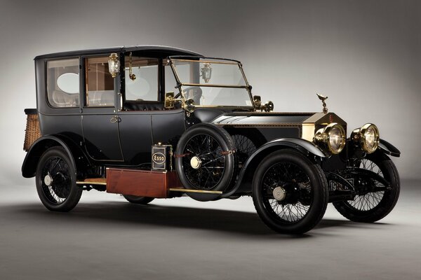 Vintage car Rolls-Royce 1915 black on gray background