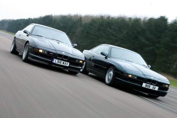 Two sports cars compete in speed