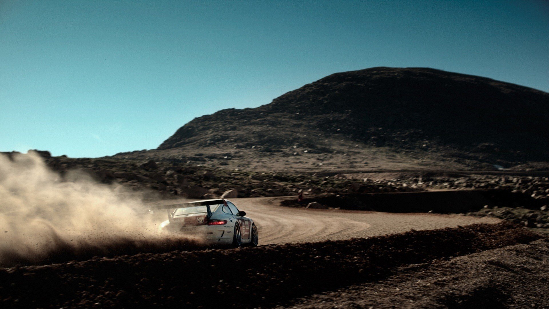 porsche 911 machine dust mountain speed road