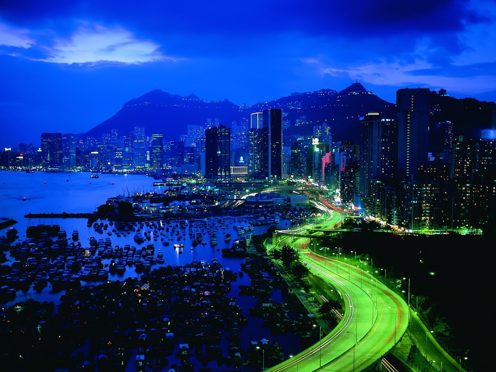 the city the evening lights skyscrapers thras light sea coast marina boat