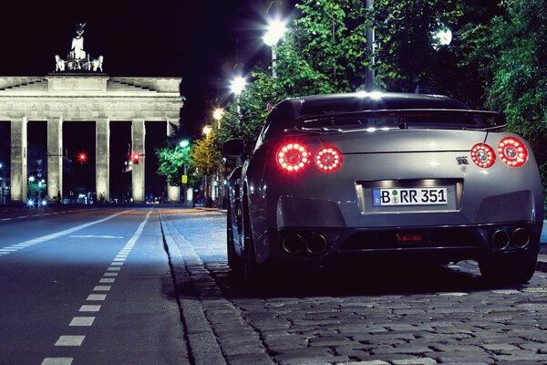 Nissan car on the background of night parking