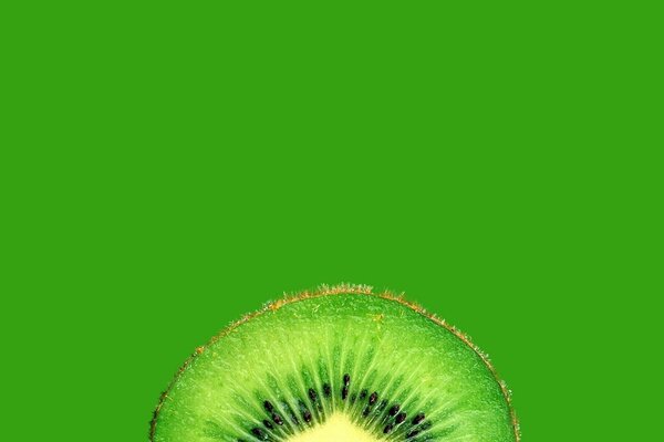 Fond d écran esthétique Kiwi en coupe. Fruit vert
