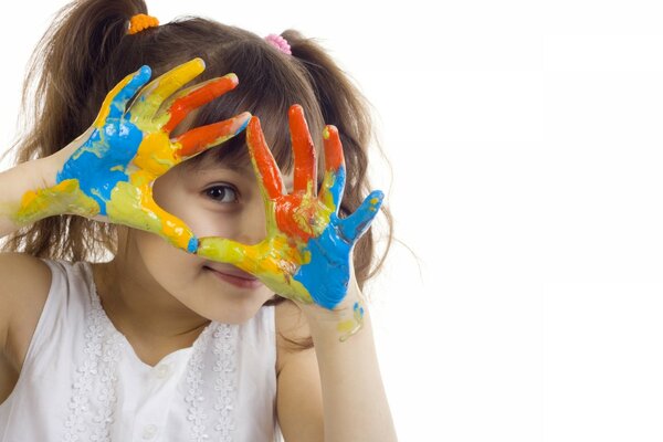 The child s hands in paint on a white background