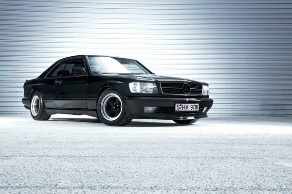 There is a black car on a white background