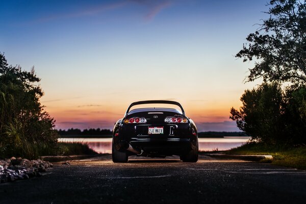 Toyota at sunset near the lake