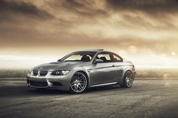 Bmw m3 grey under the sky of the apocalypse