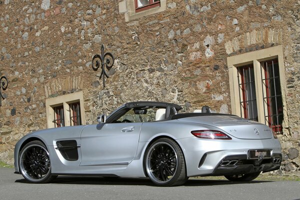 Tuned Mercedes-Benz on the background of an old building